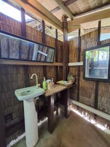 a bathroom with a sink and a tv at BlueWave Surf Stay in San Isidro