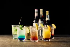 a group of four drinks on a table with bottles at Villa Fontaine Grand Tokyo Ariake in Tokyo