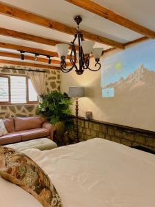 a bedroom with a bed and a large screen at SIA Home in Da Lat