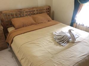 Postel nebo postele na pokoji v ubytování Arsa Homestay & Spa