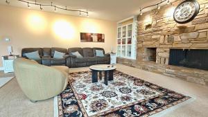a living room with a couch and a fireplace at Star Lake Shores in Kent