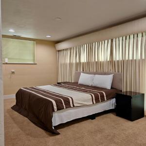 a bedroom with a large bed with a window at Star Lake Shores in Kent