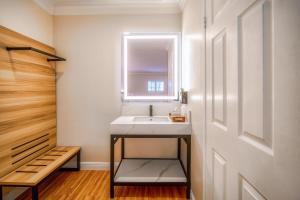 a bathroom with a sink and a window at The Beverly House by AGA - Beverly Hills in Los Angeles