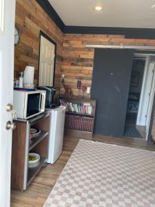 a kitchen with a refrigerator and a microwave at Flower Avenue Hosting - Private Suite with De Luxe King Size Bed - 77 per Night 1st guest - 59 2nd guest - 52 each third & 4th guests in Silver Spring