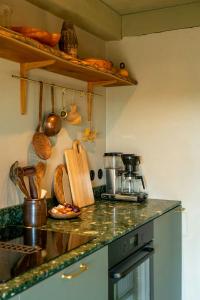 a kitchen with a counter top with bread on it at Restored House With Art In Österlen in Borrby