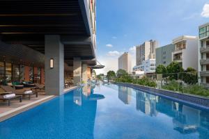 a swimming pool in the middle of a building at Four Points by Sheraton Nha Trang in Nha Trang