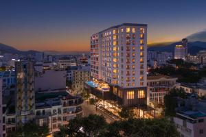 a tall building in a city at night at Four Points by Sheraton Nha Trang in Nha Trang
