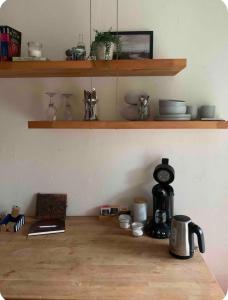 a kitchen with a coffee maker on a wooden counter at Souterrain Appartment, eigene Dusche u WC in Detmold