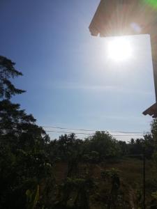 a street light with the sun in the sky at Meegoda Villa in Kalutara +2 photos