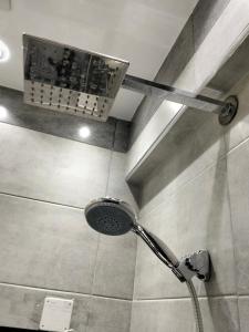 a shower in a bathroom with a shower head at Cairo City Inn Hotel in Cairo +75 photos