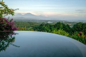 a view of the mountains from the top of a building at Sumberkima Resort in Pemuteran