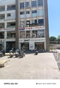 a group of motorcycles parked in front of a building at Hotel Vinayak Naroda in Ahmedabad