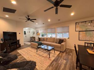 a living room with a couch and a tv at Relaxing 3BR 2 En Suites, Bikes & Helmets in Sheridan