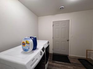 a kitchen with a appliance on top of a stove at Relaxing 3BR 2 En Suites, Bikes & Helmets in Sheridan +9 photos