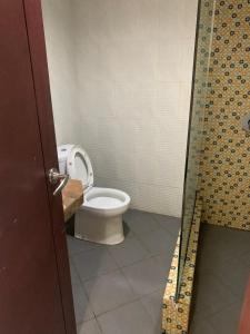 a bathroom with a toilet in a stall at Grand Pujon View in Songgoriti +14 photos