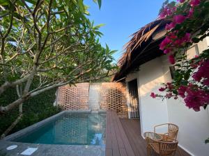 a swimming pool in the backyard of a house at BuBu Villa in Perhentian Islands