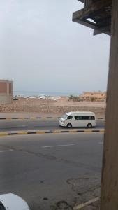 a white van driving down a street at فينوس in Hurghada