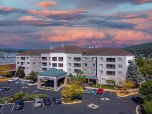 an aerial view of a hotel with a parking lot at Country Inn & Suites by Radisson, Convention Center in Altoona