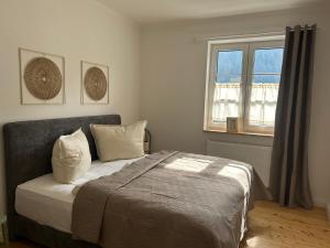 a bedroom with a bed and a window at Residenz Moselliebe Traben in Traben-Trarbach