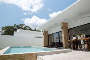 an outdoor swimming pool in a house at villa carissa 9 in Nathon Bay