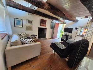 a living room with a couch and a fireplace at Casa Grillino in Locarno