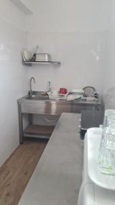 a kitchen with a sink and a counter top at VIP next TIME Casa Vacanta in Costinesti +15 photos