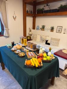 a table with many baskets of food on it at Jezírko lesní restaurant & penzion in Jáchymov