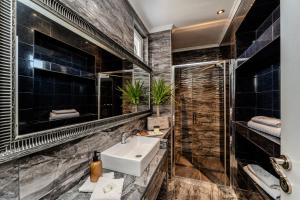 a bathroom with a sink and a shower at Villa Mart in Zadar +38 photos