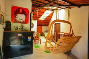 a room with a swing in a house at Home Stay in Arogyam at Mulshi Backwaters in Mulshi
