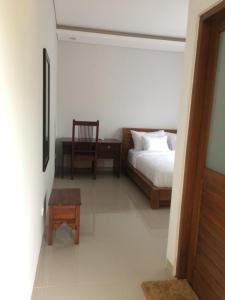Letto o letti in una camera di UmahOde Bali