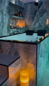 a bar in a room with a ceiling with smoke at Aura Spa Oberhausen Premium in Oberhausen