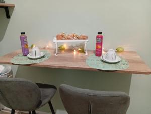 a table with two plates of food and two chairs at Le Suite di Antonella in Taranto