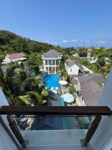 a view from the balcony of a house with a swimming pool at Villa caribe phu quoc in Phú Quốc