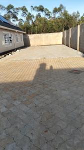 a shadow of a person taking a picture at Sam's comfy homes in Eldoret