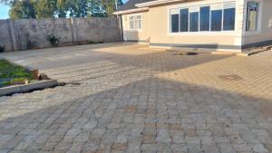 a brick driveway in front of a house at Sam's comfy homes in Eldoret