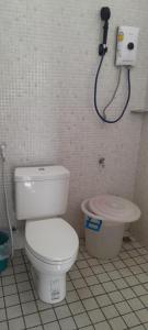 a bathroom with a toilet and a shower at Sala Thongyon - Guest House in Savannakhet +21 photos