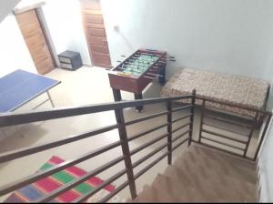 a room with two bunk beds and a table at COORG CLlMATE FARM HOUSE in Madikeri