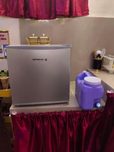 a machine sitting on top of a counter at Ciel's Deluxe Haven in Binangonan +7 photos
