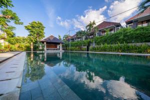an image of a swimming pool in a villa at Sayang Sanur Duplex in Sanur