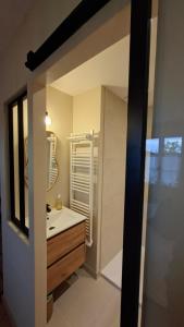 a bathroom with a sink and a mirror at LUCIA AL MARE - chambre d'hôtes in Châtelaillon-Plage