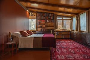 a bedroom with a bed and a large window at Agriturismo Corte d'acqua in Abano Terme