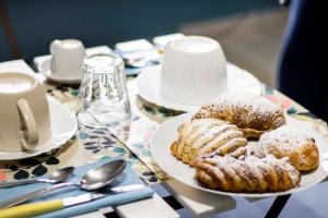a table with a plate of pastries on a table at B & B Victoria in Pompei