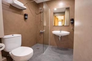 a bathroom with a toilet and a sink at La Posada d'Àneu by RdA Hotels in Esterri d'Àneu +20 photos