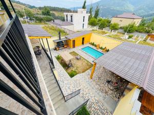 an aerial view of a house with a swimming pool at Miracle View Dilijan in Dilijan