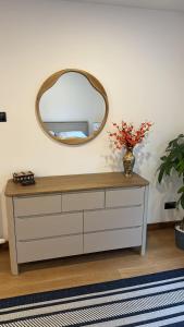a mirror on top of a dresser in a room at 1 Manse Lane in Portree