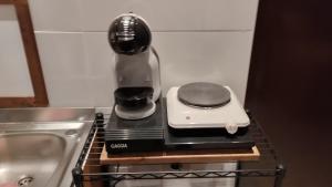 a coffee maker sitting on top of a stove at La Vecchia Posta in Anzano del Parco