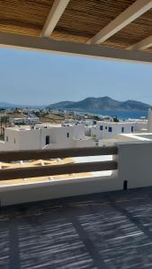 a building with white buildings in the background at Casa Elezi in Koufonisia