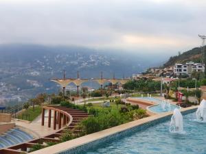 a pool at a resort with water fountains at Dreamy luxury duplex villa with a special view and 300 meters of private garden in Alanya