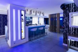 a bathroom with a blue counter and stools in it at Rox in Modriča +30 photos