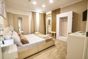 a bedroom with a large bed and a bathroom at My Place B&B in Carini +134 photos